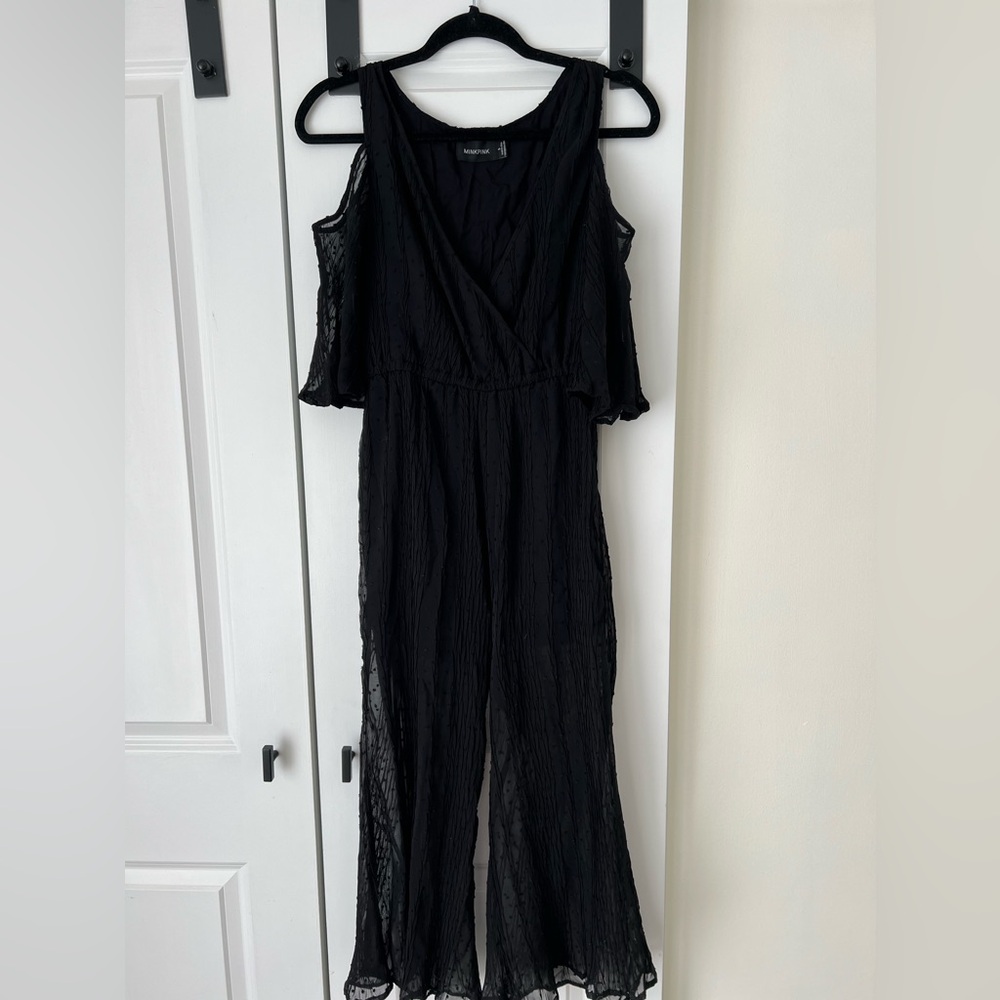 Black cropped jumpsuit with open shoulder